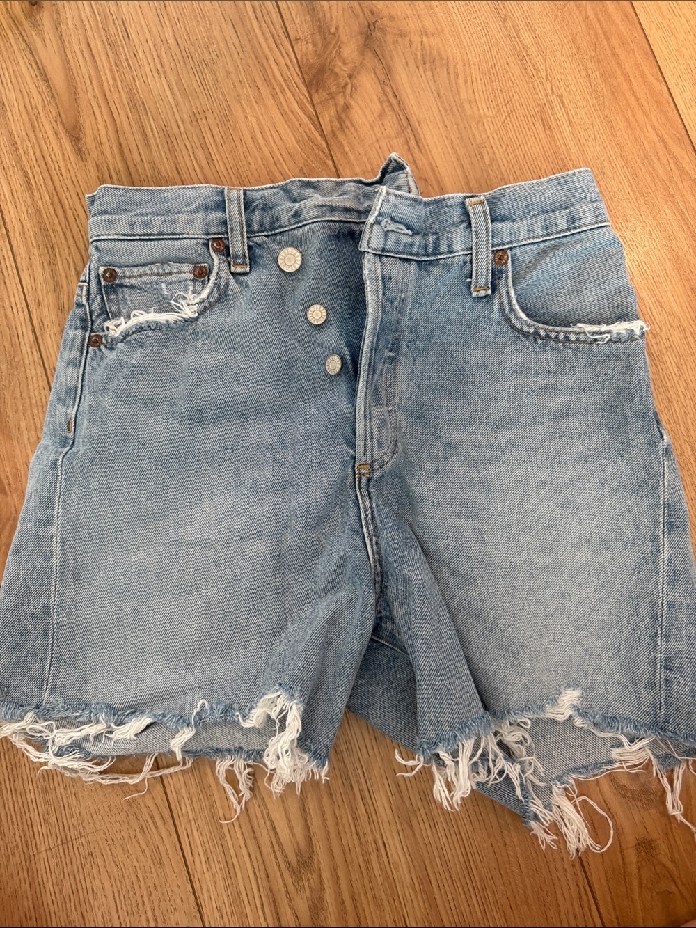 Agolde Light Wash Distressed Denim Cutoff Shorts